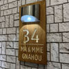 Picture of Custom Waterproof Wooden Solar Light House Sign - Personalised Engraved Door Number Sign Plaque - LED Lit Numbers